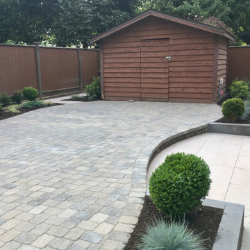 Patio connecting to the shed with wide curved step up