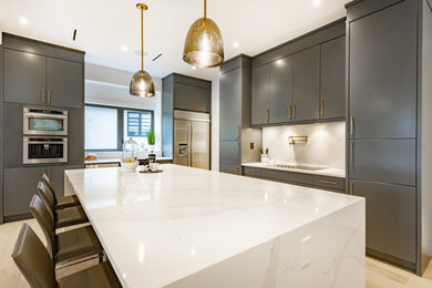 Inspiration for a mid-sized modern galley vinyl floor and white floor eat-in kitchen remodel with an undermount sink, flat-panel cabinets, black cabinets, marble countertops, brown backsplash, wood backsplash, stainless steel appliances, an island and black countertops
