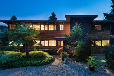 Example of a minimalist wood exterior home design in San Diego