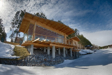 Inspiration for a small contemporary one-story wood exterior home remodel in Other