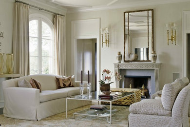Example of a classic living room design in New York with beige walls, a standard fireplace and a stone fireplace