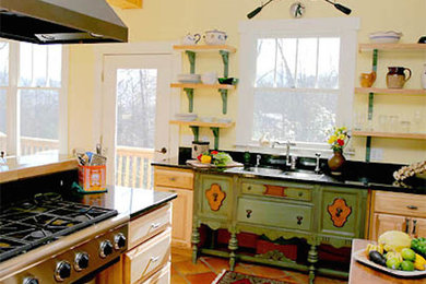 Kitchen - terra-cotta tile kitchen idea in Other with shaker cabinets, light wood cabinets, granite countertops, colored appliances and an island