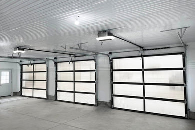 Example of a large three-car garage design in Toronto
