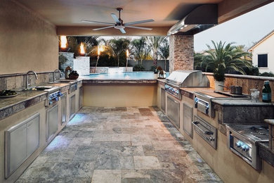 Inspiration for a rustic brick patio remodel in Phoenix