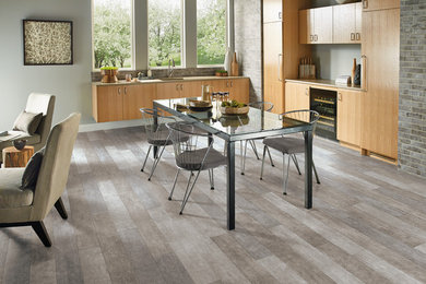 Great room - large transitional gray floor great room idea in Detroit with gray walls and no fireplace