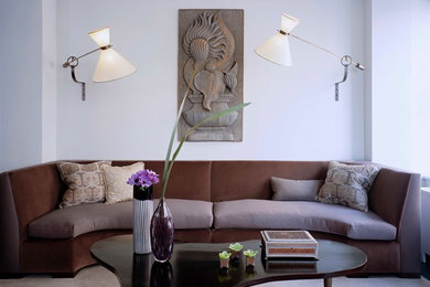 Example of a trendy carpeted living room design in New York with white walls