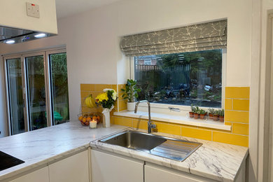 Kitchen - small modern single-wall kitchen idea in Other