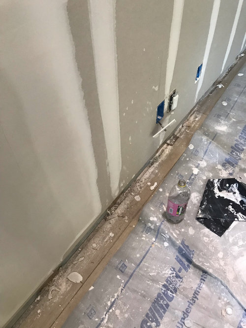 Drywall dust and mud on the vinyl floor