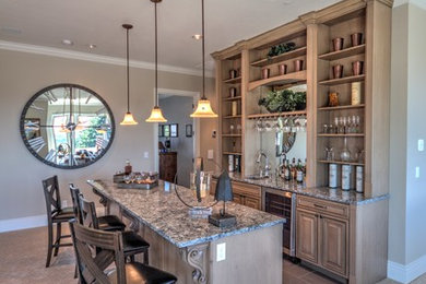 Large galley seated home bar photo in Portland with recessed-panel cabinets, medium tone wood cabinets and granite countertops
