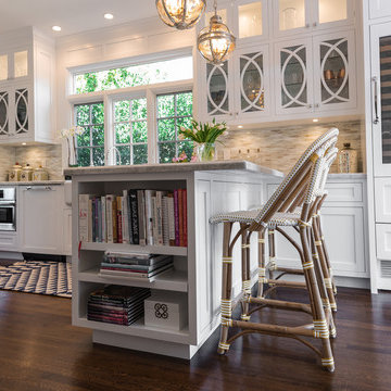 Open and bright. Traditional lighting and cabinetry mix with modern conveniences
