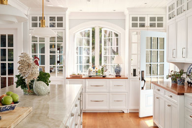 Kitchen - large transitional kitchen idea in Other with shaker cabinets, white cabinets and an island