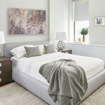 A neutral colored bed frame was purchased to give the apartment a continuous fee