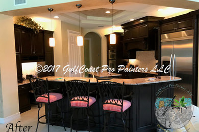 Minimalist eat-in kitchen photo in Other with brown cabinets, stainless steel appliances and an island
