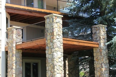Outdoor kitchen deck - large traditional backyard outdoor kitchen deck idea in Denver with a roof extension