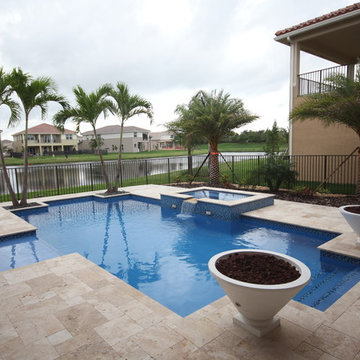 Custom Pool & Spa with Partially Raised Spa, and Fire Bowls in Boynton Beach