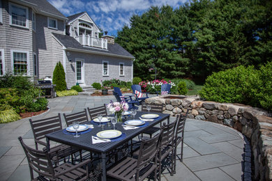Example of a mountain style patio design in Boston