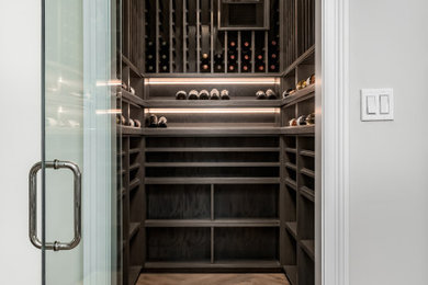 Inspiration for a mid-sized timeless wine cellar remodel in Chicago with storage racks