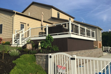 Example of an arts and crafts deck design in Cleveland