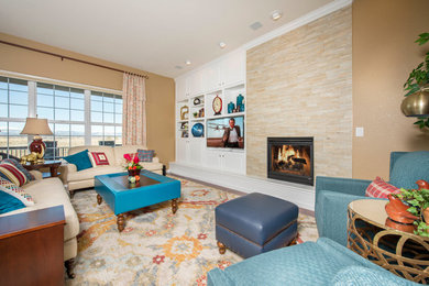 Inspiration for a mid-sized transitional open concept living room in Denver with beige walls, medium hardwood floors, a standard fireplace, a tile fireplace surround and a built-in media wall.