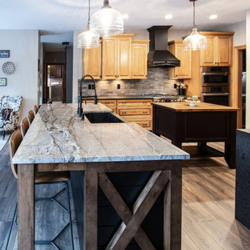 Reconfigured kitchen with new islands, countertops, backsplash