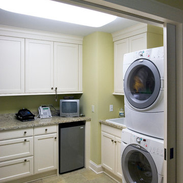 Second Floor Laundry with Brookhaven Cabinets and Venetian Gold Granite Couterto