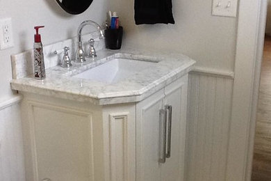 Inspiration for a mid-sized timeless master white tile and porcelain tile porcelain tile alcove shower remodel in Other with an undermount sink, furniture-like cabinets, white cabinets, a two-piece toilet and white walls