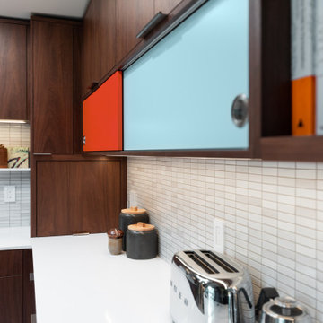 Colorful Bi-Pass Accent Cabinet Doors in MidCentury Modern Kitchen