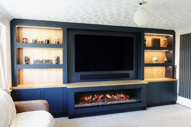 Large contemporary living room in Other with white walls, carpet and a built-in media unit.