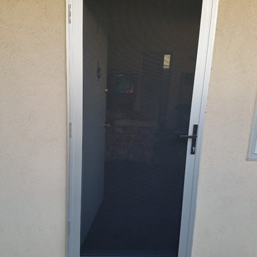 8 Mill Finish Security Screen Doors on an apartment building in Long Beach