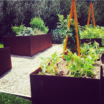 Raised corten steel edible planters with Akoris Garden Tuteur
