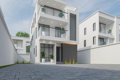Mid-sized modern white two-story wood and board and batten exterior home idea in Other with a metal roof and a gray roof
