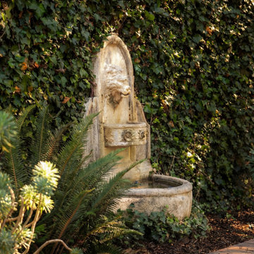 Garden fountain set against ivy wall in Pebble Beach