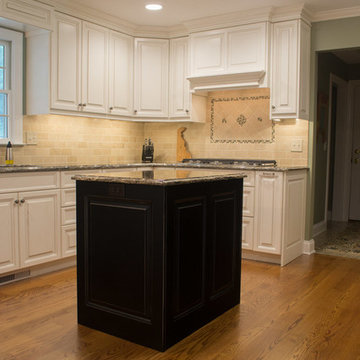 White Tradition Kitchen with a Black Island in Magnolia, DE