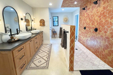Bathroom - master orange tile and terra-cotta tile concrete floor and double-sink bathroom idea with shaker cabinets, medium tone wood cabinets, a vessel sink, concrete countertops, black countertops and a built-in vanity
