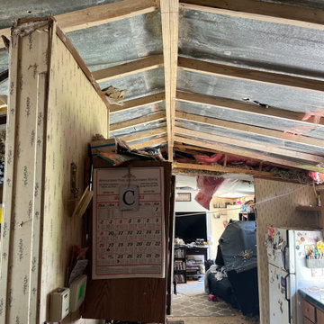 Tree fell through trailer roof repair