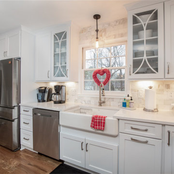 The glass cabinets on either side of the window bring a lightness to the space.