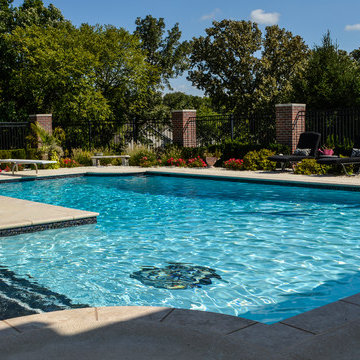 Grecian swimming pool with L, diving board and hot tub