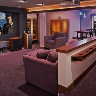 Inspiration for a large modern enclosed home cinema in Denver with multi-coloured walls, carpet, a projector screen and purple floors.