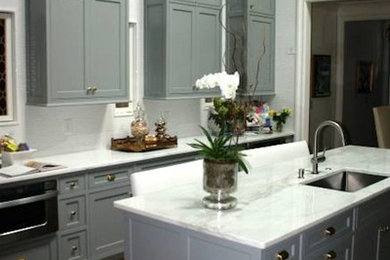 Inspiration for a large timeless u-shaped dark wood floor eat-in kitchen remodel in Raleigh with a single-bowl sink, gray cabinets, marble countertops, an island and recessed-panel cabinets