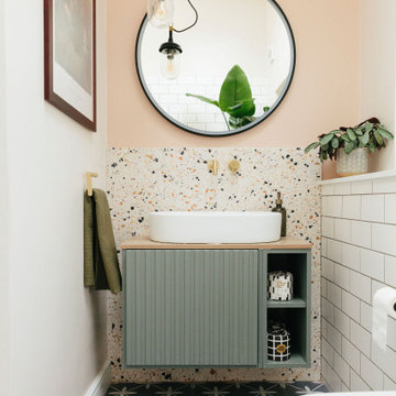 Pink & green bathroom with mix of tiles & patterns