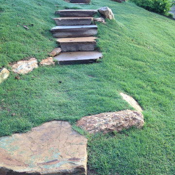 Cut Stone Boulder Steps Set into Sloped Lawn