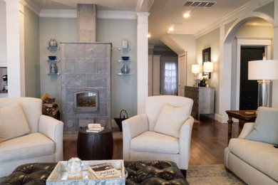 Living room - large traditional open concept dark wood floor living room idea in Providence with blue walls, a wood stove and a stone fireplace