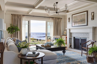 Example of a huge beach style living room design in Portland Maine