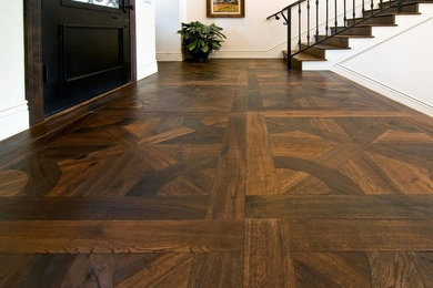 Entryway - mid-sized traditional dark wood floor entryway idea in San Diego with white walls and a dark wood front door
