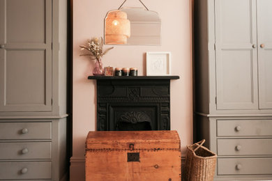 Inspiration for a large eclectic master painted wood floor and white floor bedroom remodel in Other