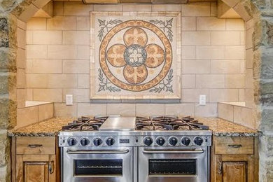 Large dark wood floor and brown floor kitchen photo in Austin with granite countertops, beige backsplash and stainless steel appliances