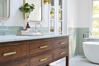 Inspiration for a large modern master bathroom in Bridgeport with flat-panel cabinets, dark wood cabinets, a freestanding tub, green tile, porcelain tile, white walls, marble floors, an undermount sink, marble benchtops, white floor and white benchtops.