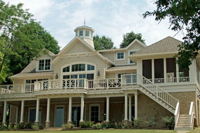 Elegant multicolored three-story mixed siding exterior home photo in Columbus