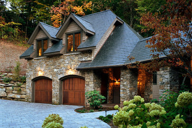 Design ideas for a traditional three-storey grey house exterior in Atlanta with stone veneer.