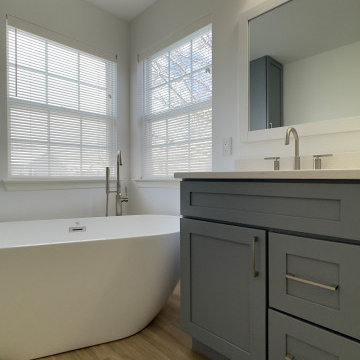 Spacious Bathroom with Dual Vanity and Freestanding Tub